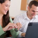 couple-working-on-wedding-budget-on-laptop